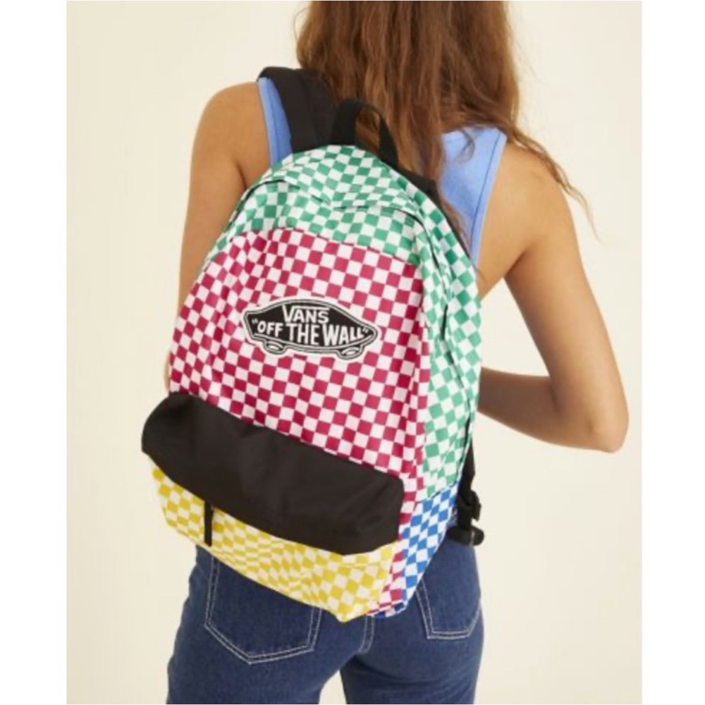 Vans Realm backpack features a vibrant multicolor checkerboard pattern.